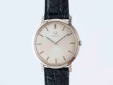 a close up of a watch on a black leather strap