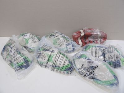 many bags of food that are sitting on a table