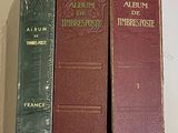 three books that are sitting on a white table