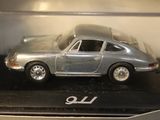 a toy car in a display case on a table