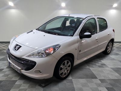 a picture of a small white car parked in a garage