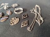 many different types of jewelry on a table