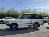 an image of a white land rover parked in a parking lot