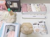a table with a lot of baby items on it