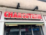 a sign that says charquetrie on the side of a building