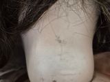 a close up of a mannequin head with hair on it