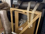 a pile of boxes and other items in a room
