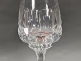 a wine glass that is sitting on a table