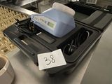 une photo d'une machine sur laquelle est apposée une étiquette de prix