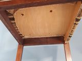 a wooden table with a basket on top of it