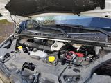 the engine of a car with its hood open and the hood open