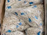 a cardboard box filled with a bunch of white noodles