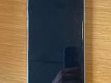 someone is taking a picture of their cell phone on a wooden table