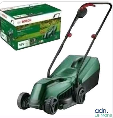 the lawn mower is being used to mow the grass