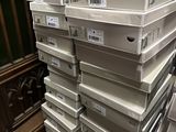boxes stacked on top of each other on the floor in a store