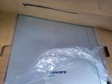 a person opening a box with a laptop inside of it