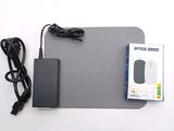 a mouse pad with a mouse and a power cord on it