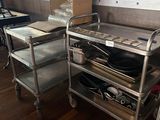 a silver cart with a pan on it in a kitchen