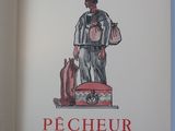 a book with a picture of a man standing on top of a suitcase