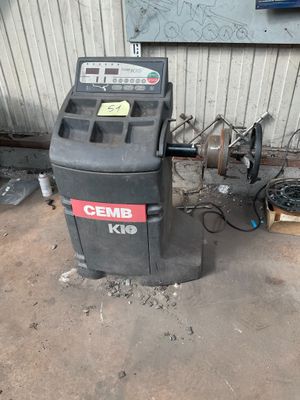 a trash can sitting next to a trash can in a garage