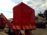 a red truck that is parked on the side of the road