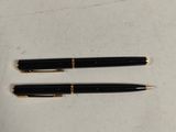 a pen and a pair of glasses sitting on a table