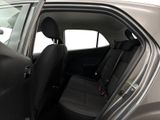the back seat of a car with the door open and the driver ' s seat down
