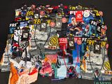 a pile of assorted items on a black surface