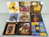 various album covers of various music albums on a table