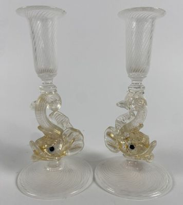 two clear glass vases with gold fish on them