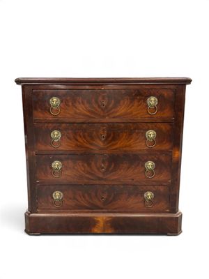 an antique chest of drawers with brass handles