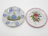 two plates that are sitting on a table