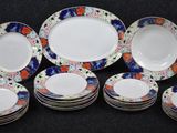 a lot of plates that are sitting on a table