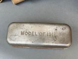 an old metal object sitting on top of a table next to a bag