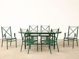 an image of a green table and chairs in a room
