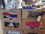 boxes of clothing are stacked on top of each other in a warehouse