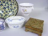 many different types of dishes and bowls on the table