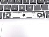 a close up of a laptop keyboard with a broken key board