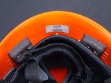 a close up of a helmet with a name tag on it