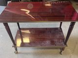 an image of a table with a glass top on wheels