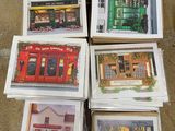 several boxes of cards are stacked on top of each other