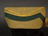 an image of a green and yellow purse with a tassel on it