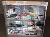 a metal cart with many items in it in a garage