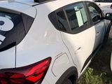 many cars that are parked in a lot with stickers on them