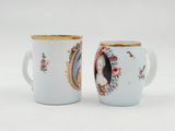 two coffee cups with a picture of a woman and a man on them