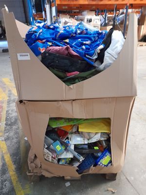 a cardboard cart with a lot of items inside of it