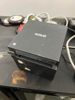 a black box sitting on top of a black table