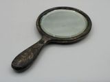 a small magnifying mirror sitting on a table