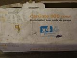 a cardboard box with a sticker on it sitting on the floor