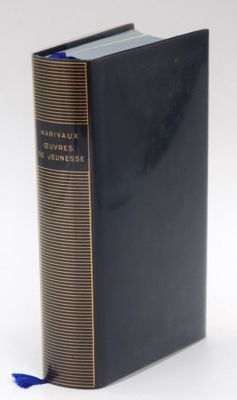 a black book with a blue ribbon on top of it